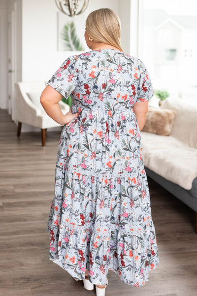 Black view of the plus size blue floral tiered dress