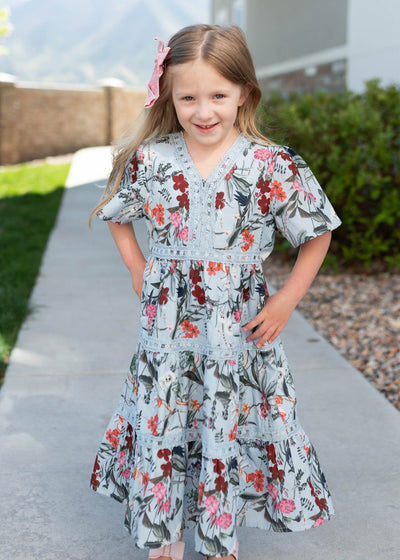 Blue floral tiered little girl dress with lace trim and v-neck