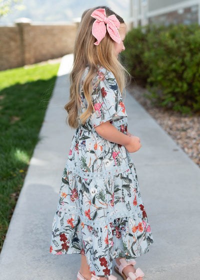 Side view of the blue floral tiered little girl dress