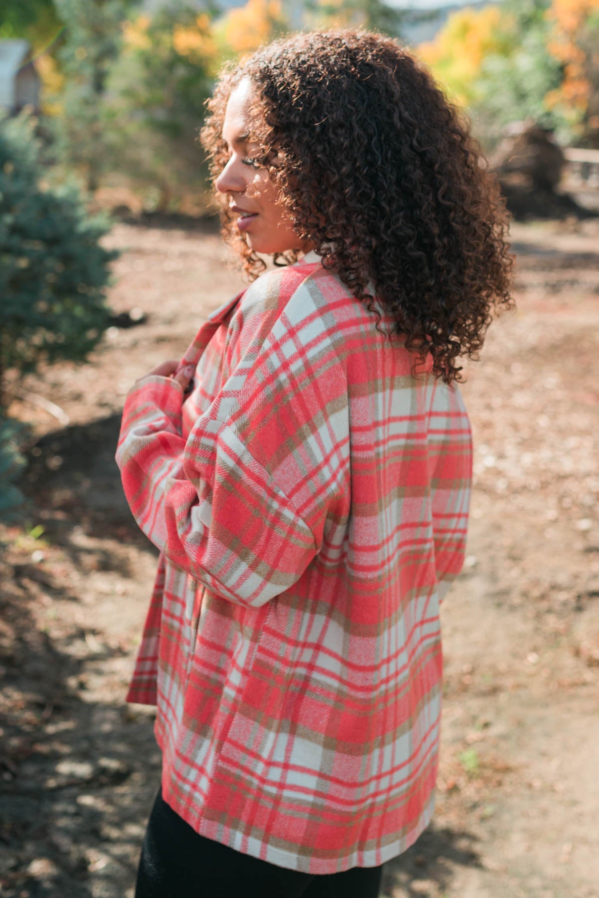 Side view of the coral plaid shacket