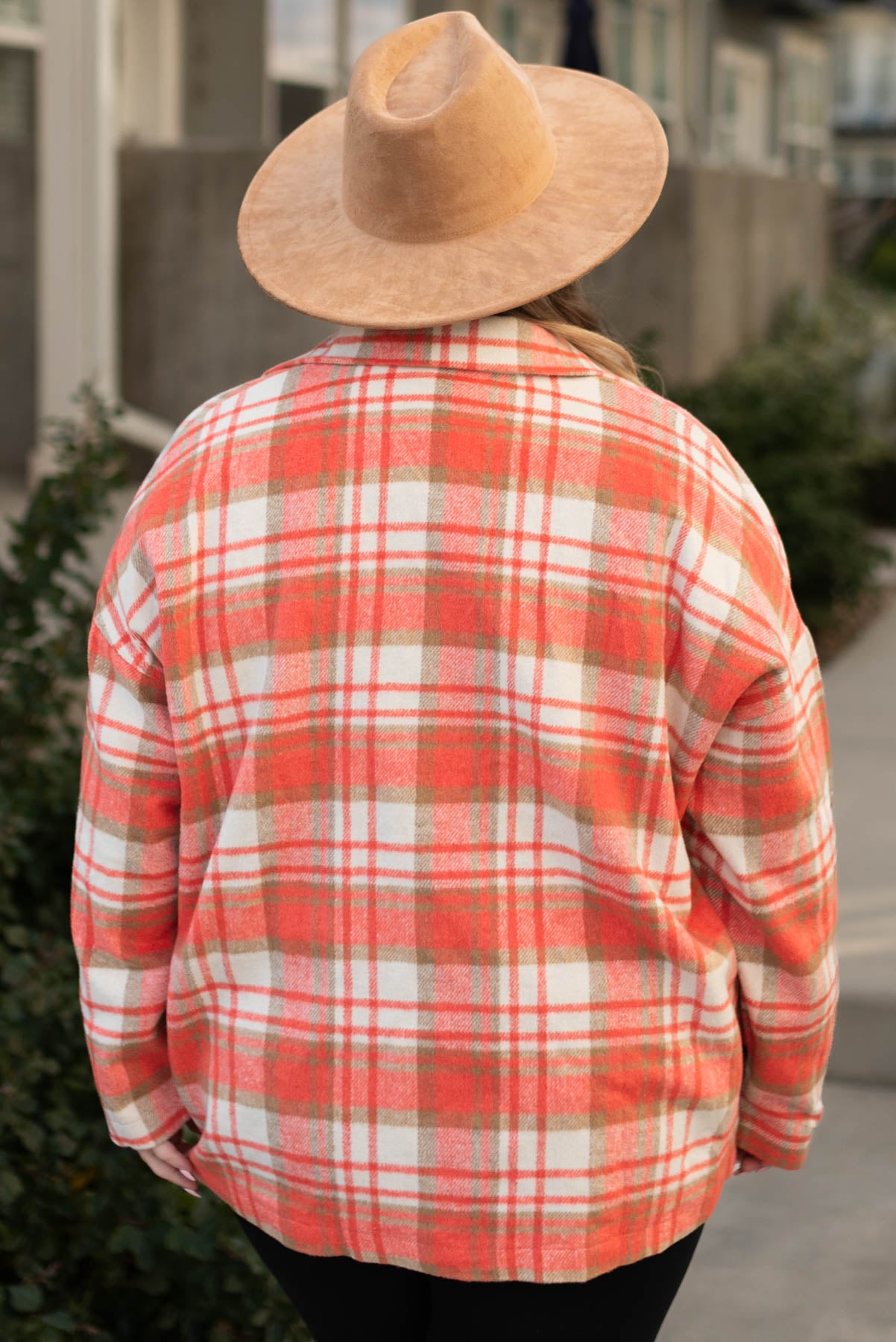 Back view of a plus size coral plaid shacket