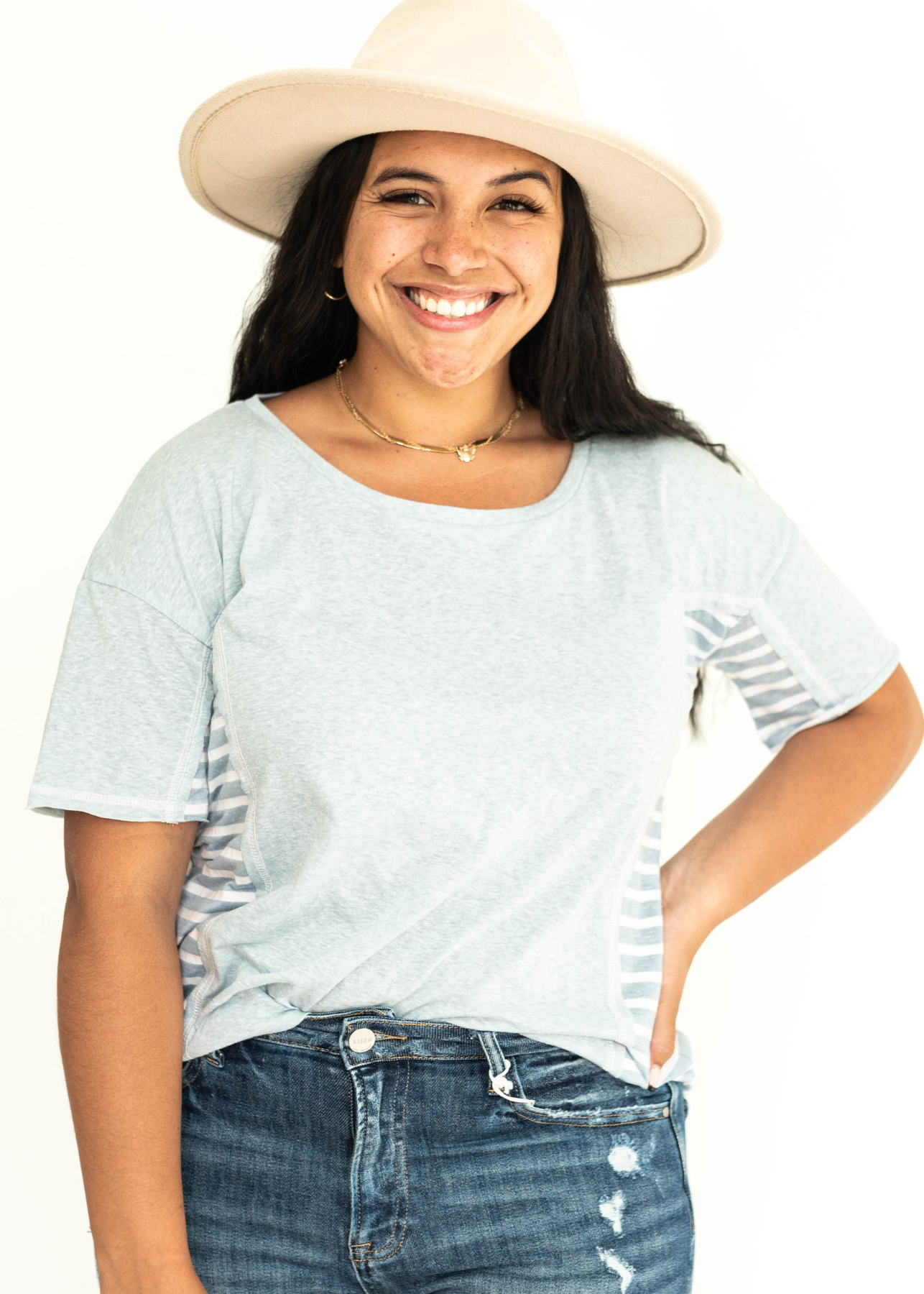 Short sleeve soft blue top with stripes on the sides.