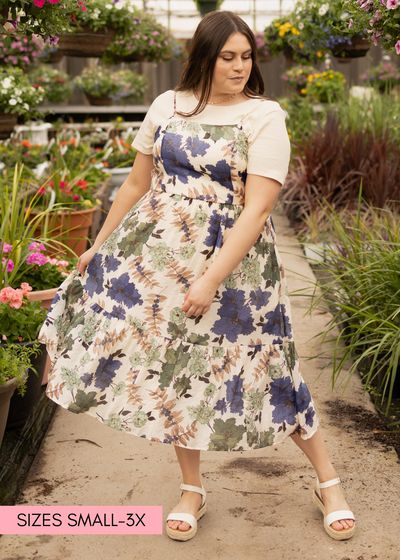 Front view of a plus size cream floral dress