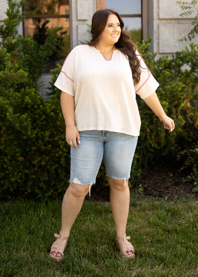 Plus size cream top with a v-neck