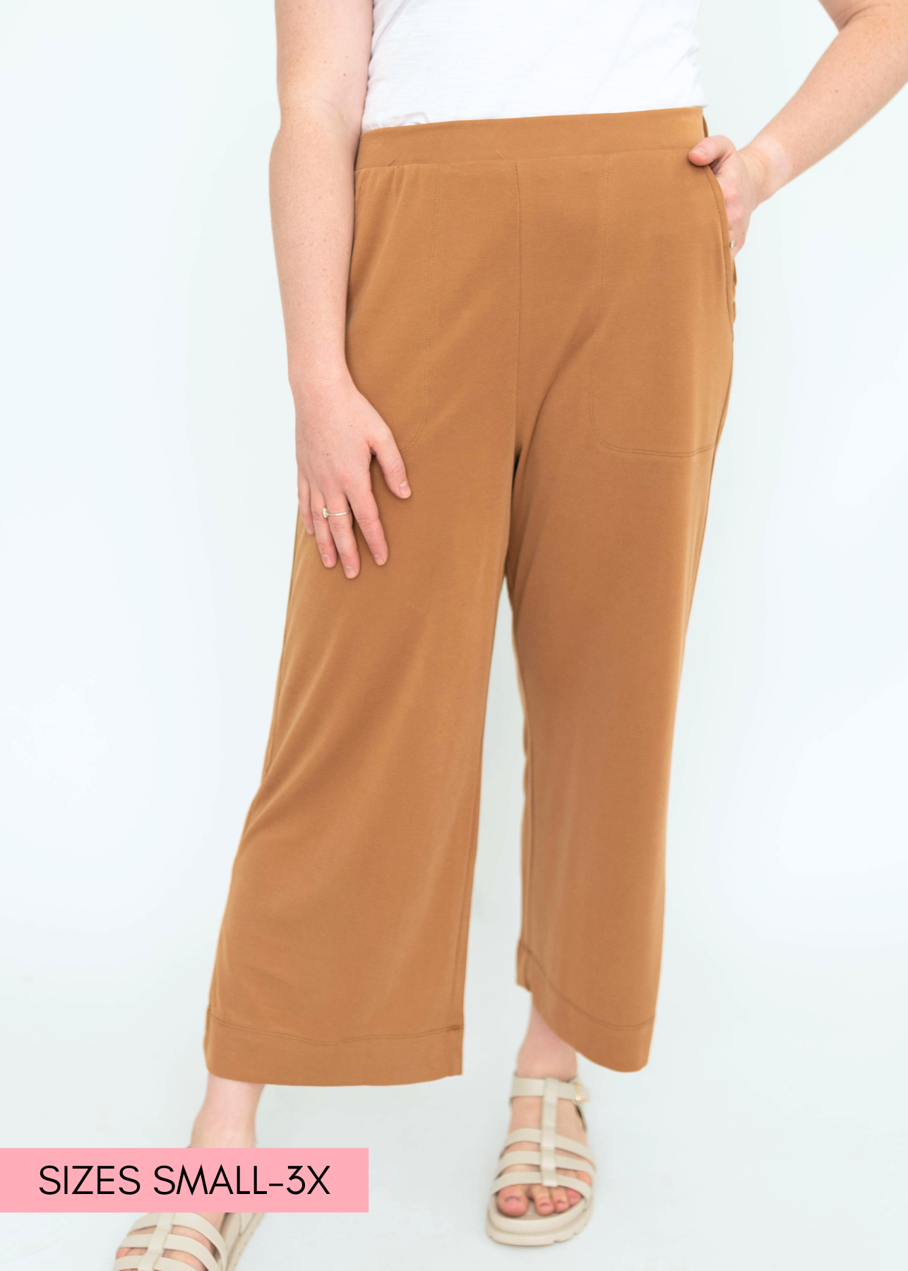  Front view of a mocha colored wide leg knit pants.