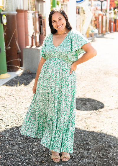 Short sleeve kelly green dress with a v-neck and tiered skirt