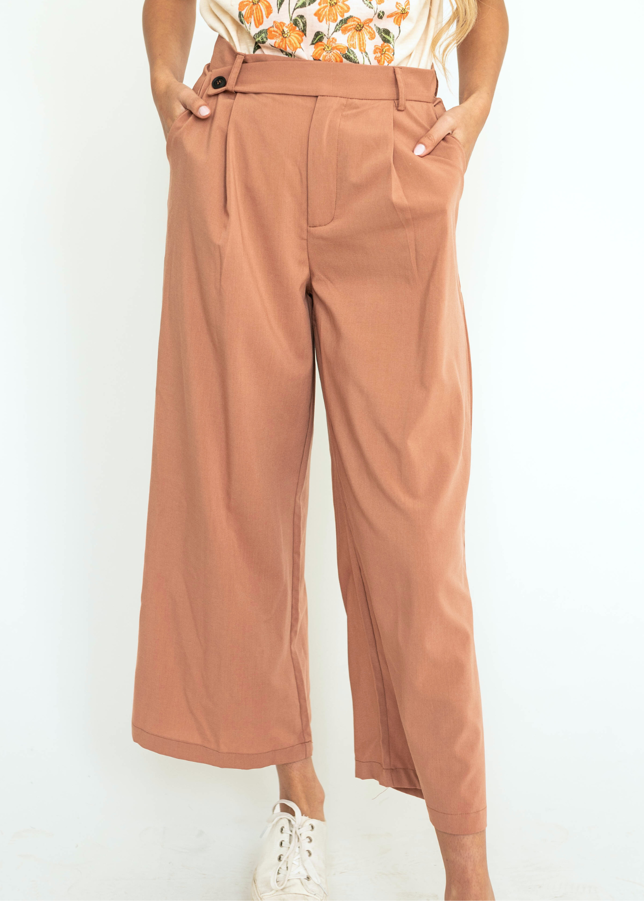 Caramel wide leg pleated pants with button at waist.