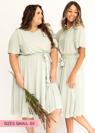 Short sleeve pale sage dress that ties at the waist.