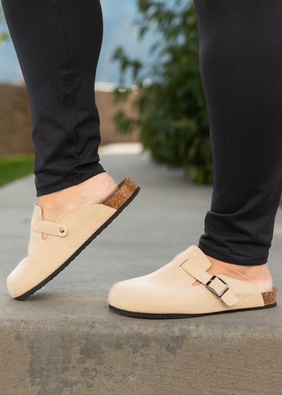 Taupe slip on clogs with buckles on the sides