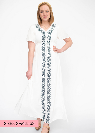 White dress with short sleeves and blue embroidery down the front