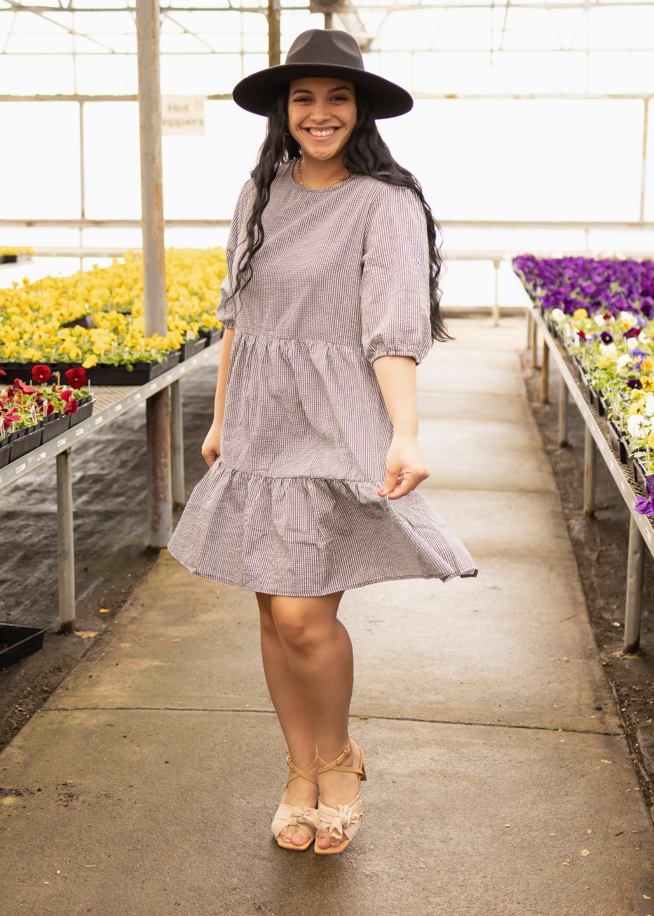 Short sleeve black dress with checker pattern and tiered skirt