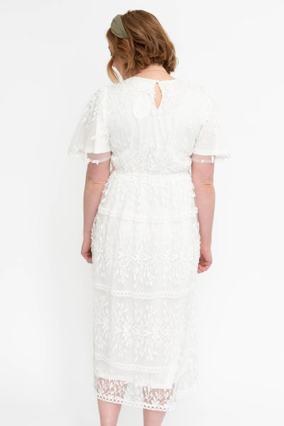 Back view of a white floral dress
