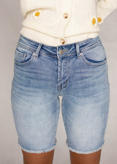 Front view of medium wash shorts