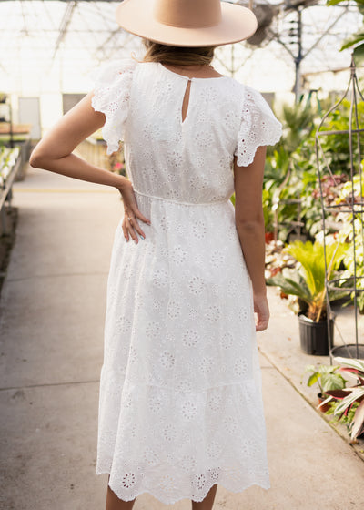 Back view of a white eyelet dress
