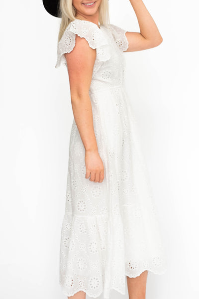 Side view of a white eyelet dress