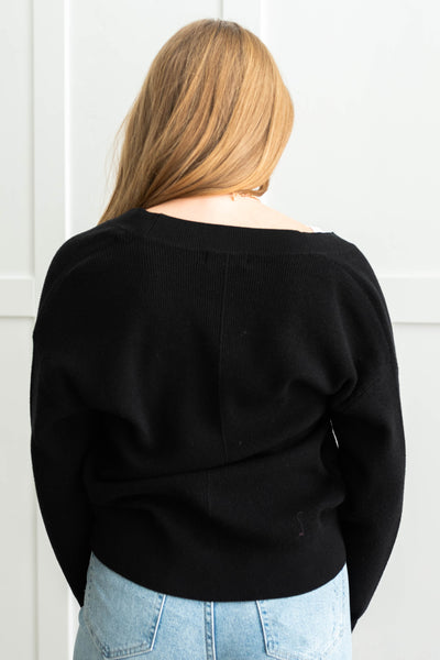 Back view of a long sleeve black cardigan