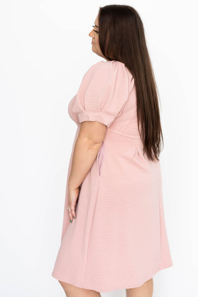 Side view of a dusty pink dress