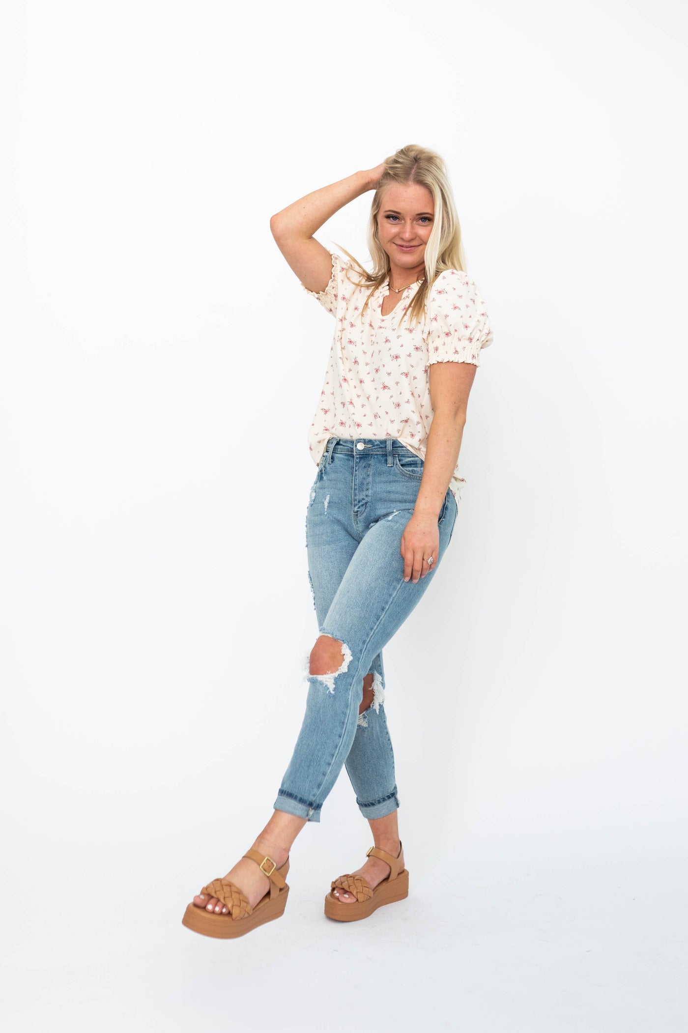 Short sleeve cream floral top with a v-neck