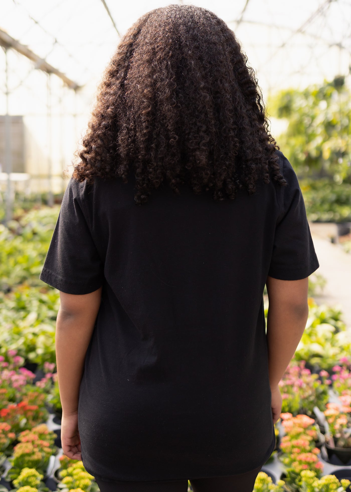 Back view of a black tee