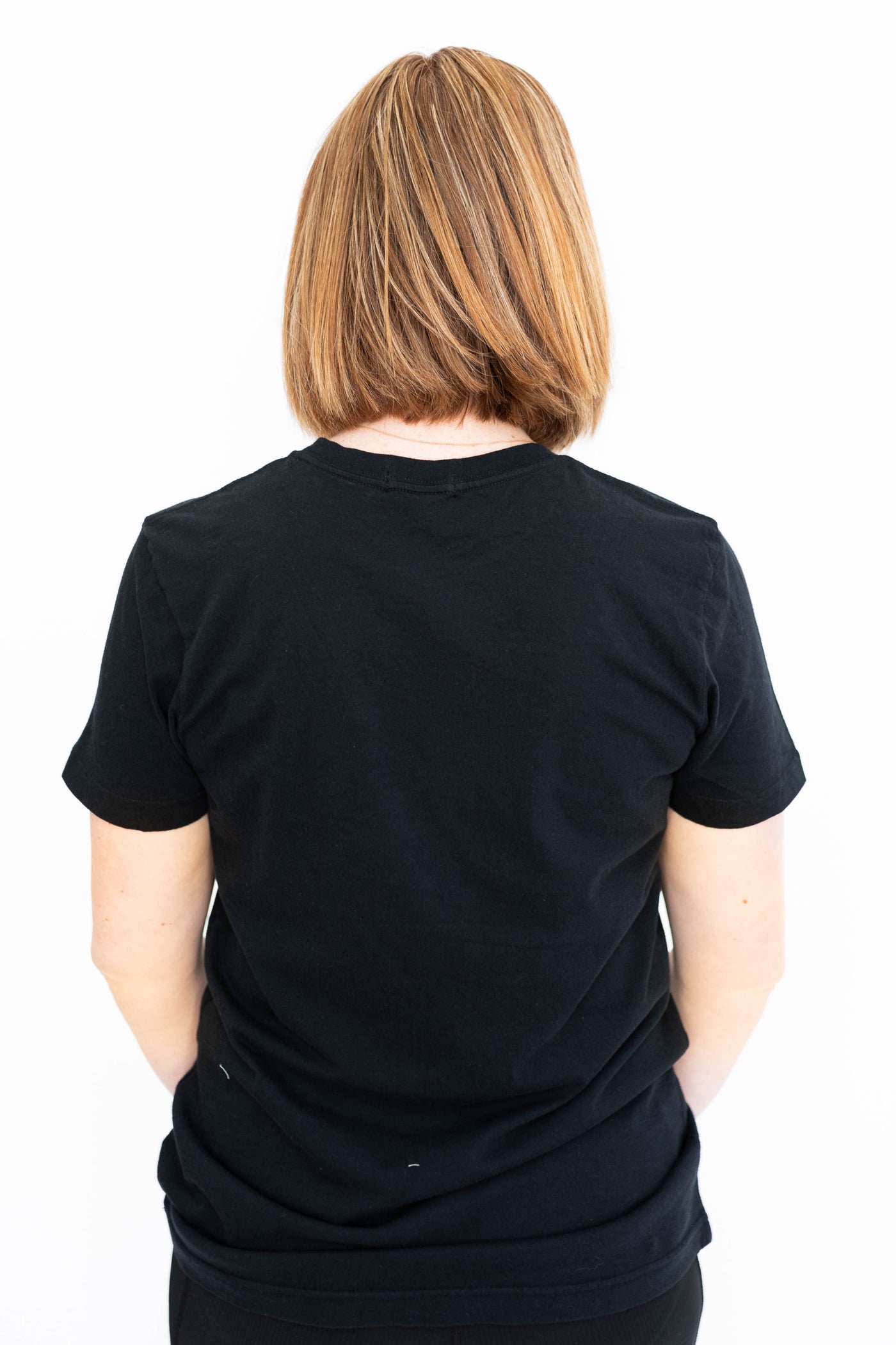 Back view of a cowboy black tee