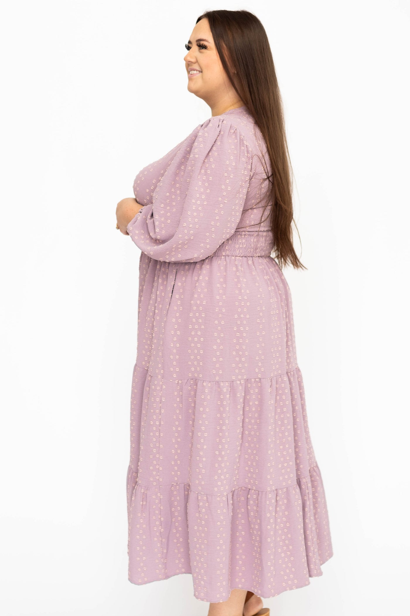 Side view of a plus size lavender dress