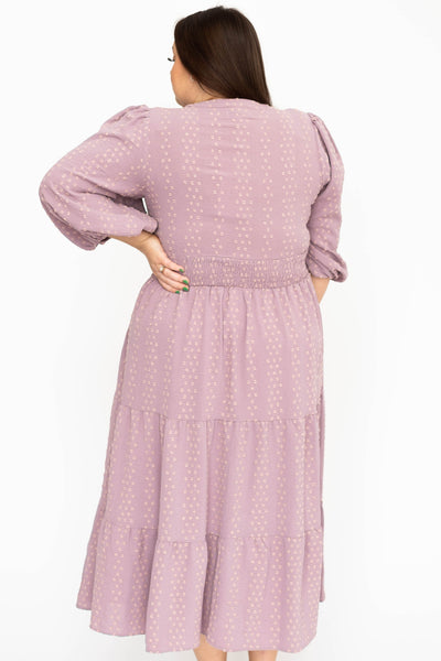 Back view of a plus size lavender dress