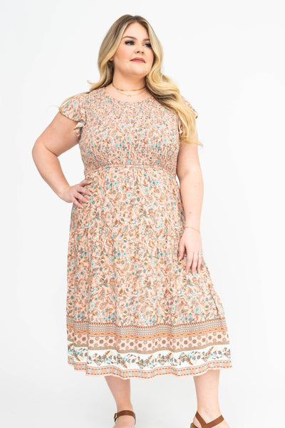 Smocked bodice on a plus size peach dress