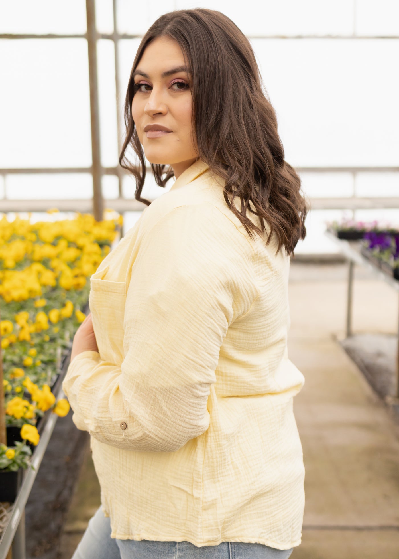 Side view of a plus size yellow top