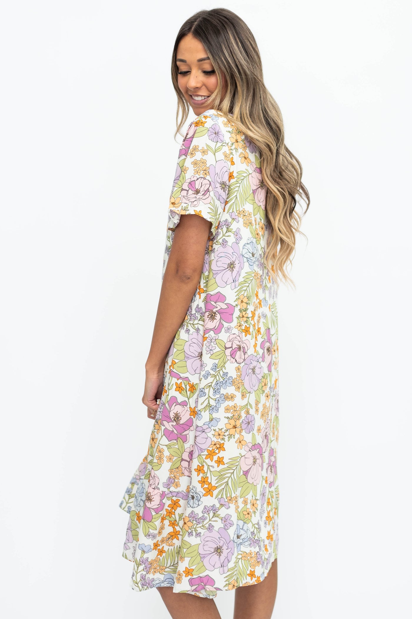 Side view of a ivory floral dress