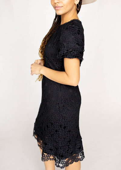 Side view of a short sleeve black lace dress