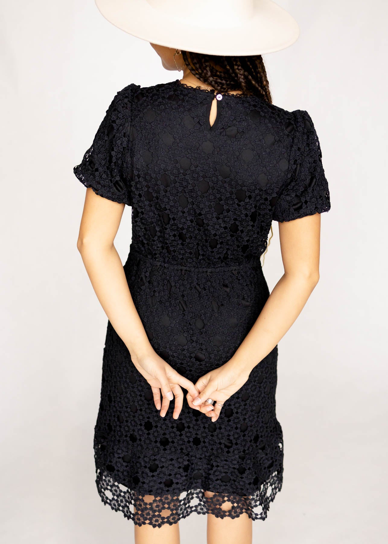 Back view of a black lace dress