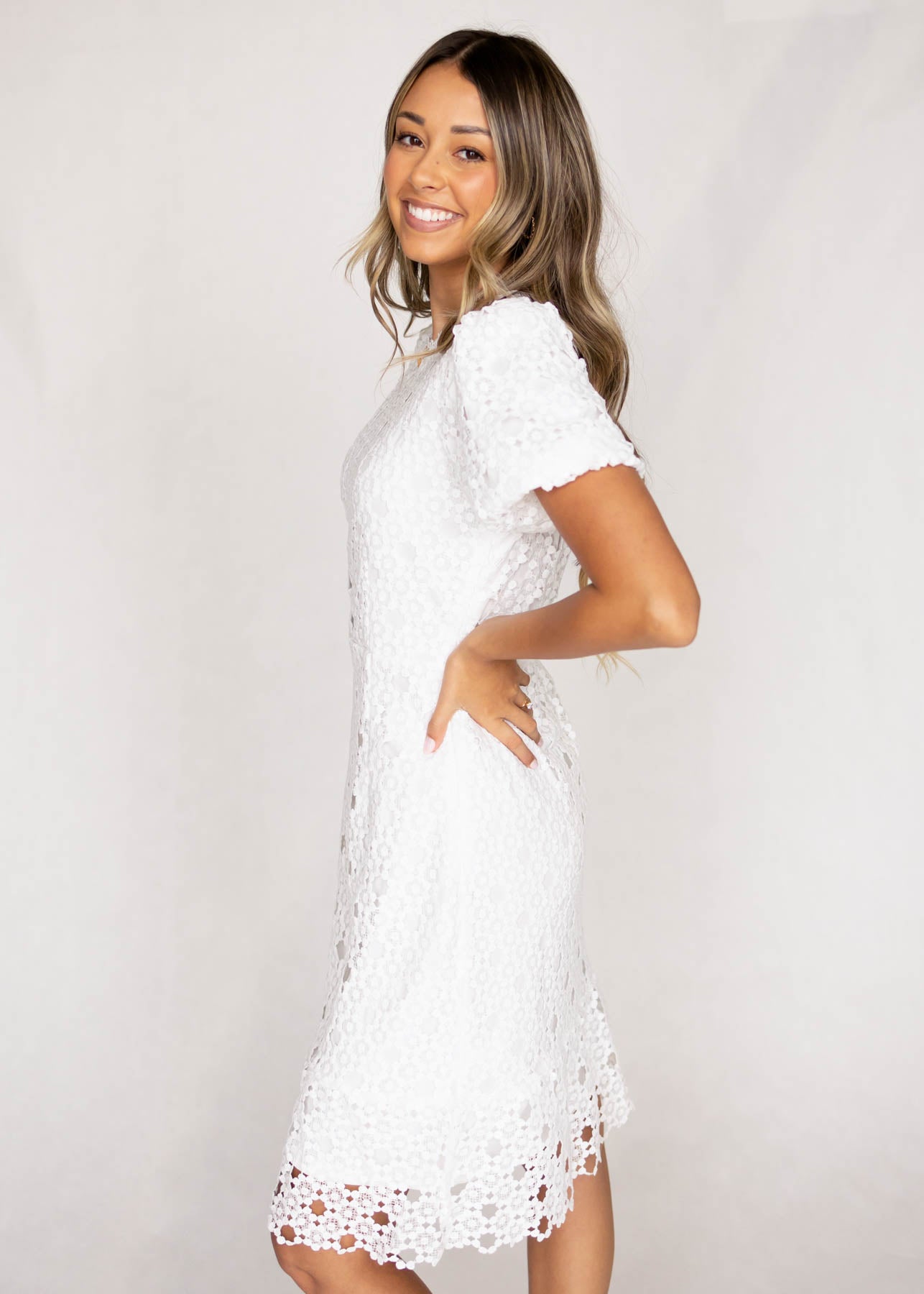 Side view of a white lace dress