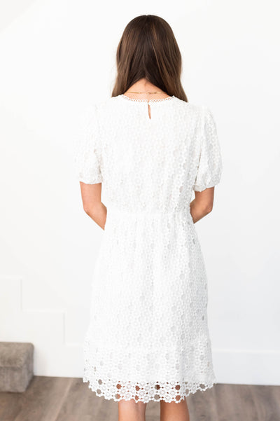 Back view of a white lace dress