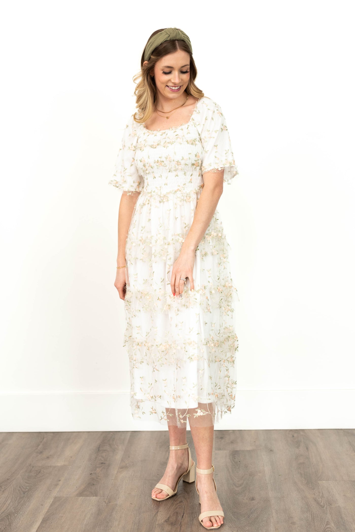 White floral dress with short sleeves and embroidery on the netting