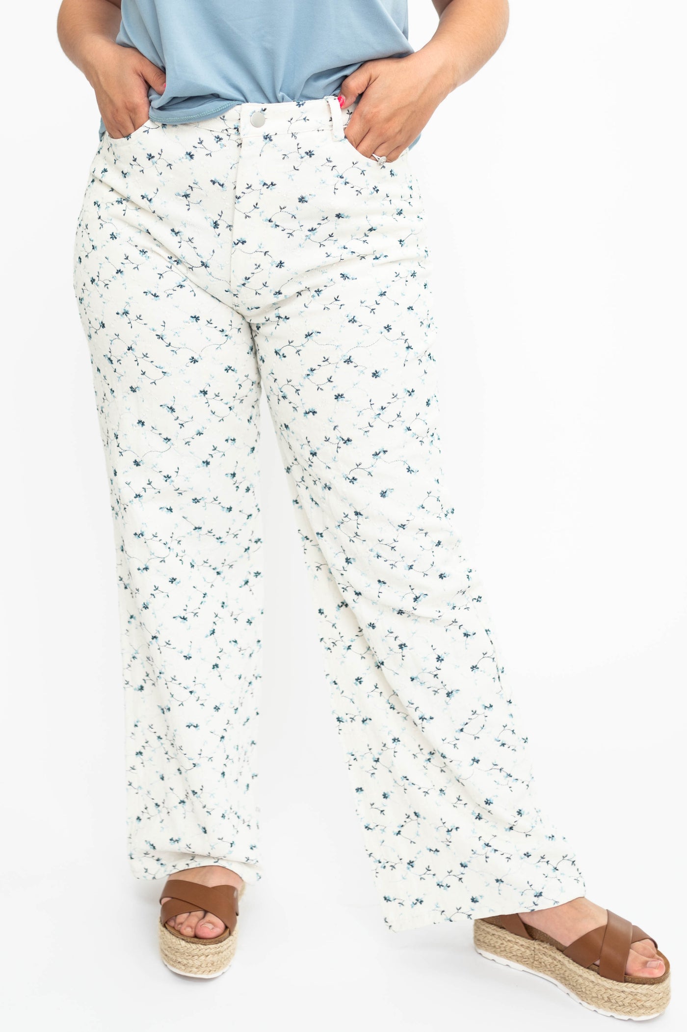 Front view of large ivory floral pants