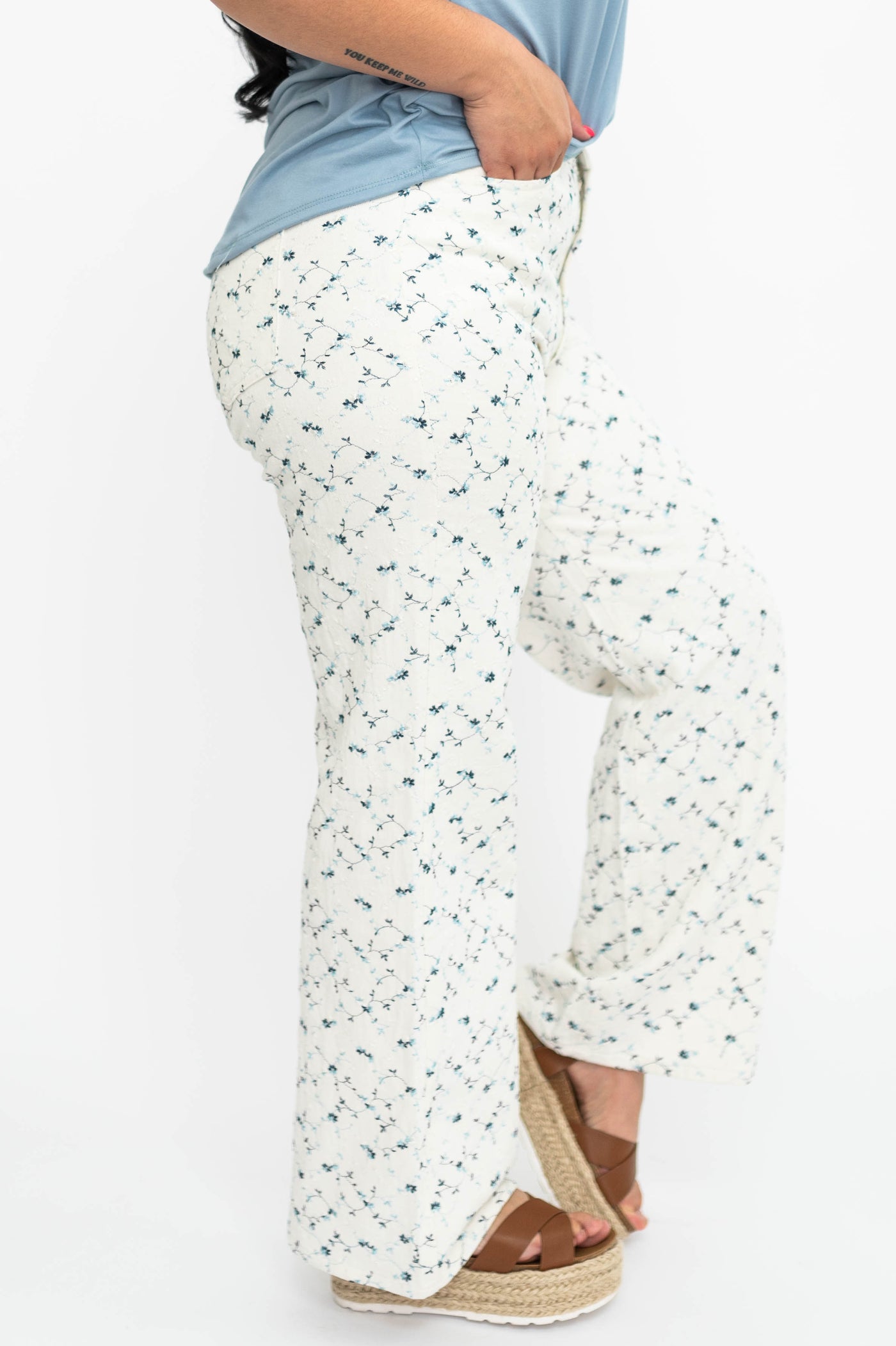 Side view of large ivory floral pants