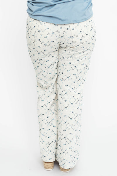 Back view of large ivory floral pants