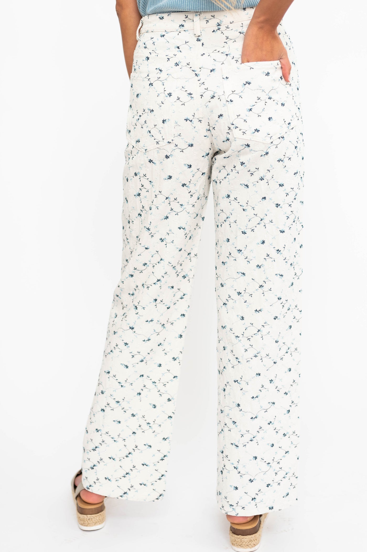 Back view of ivory floral pants