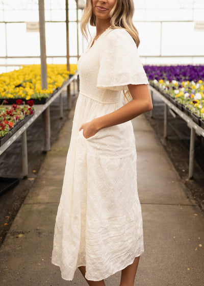 Side view of a cream dress