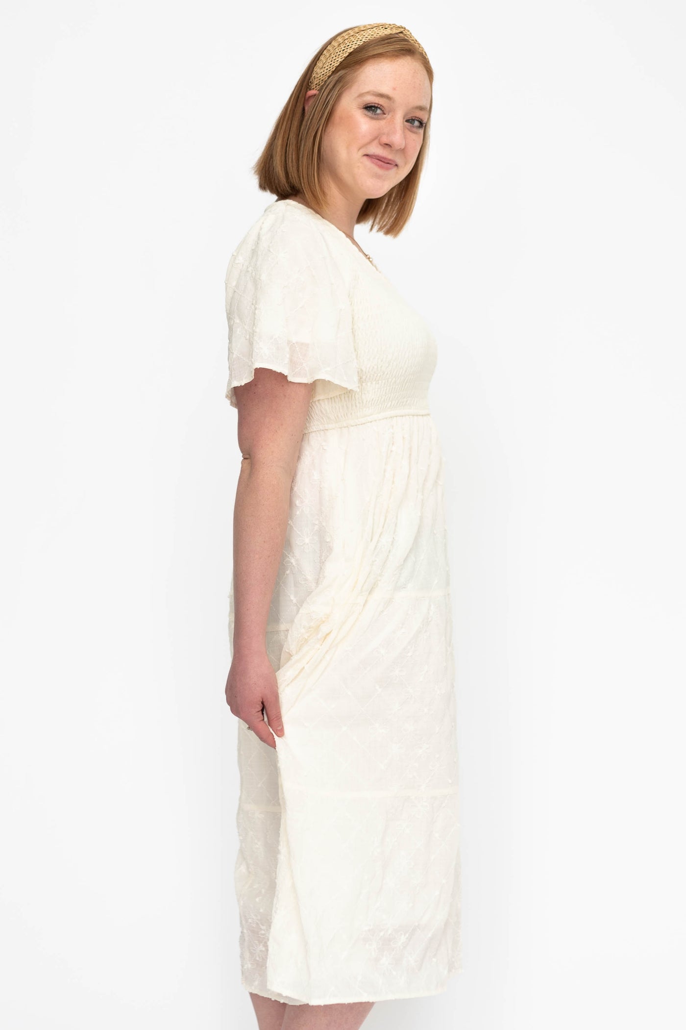 Side view of a cream dress