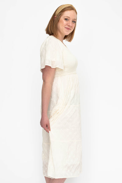 Side view of a cream dress