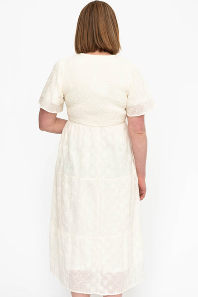 Back view of a cream dress
