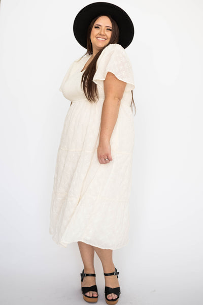 Short sleeve plus size cream dress with smocked bodice