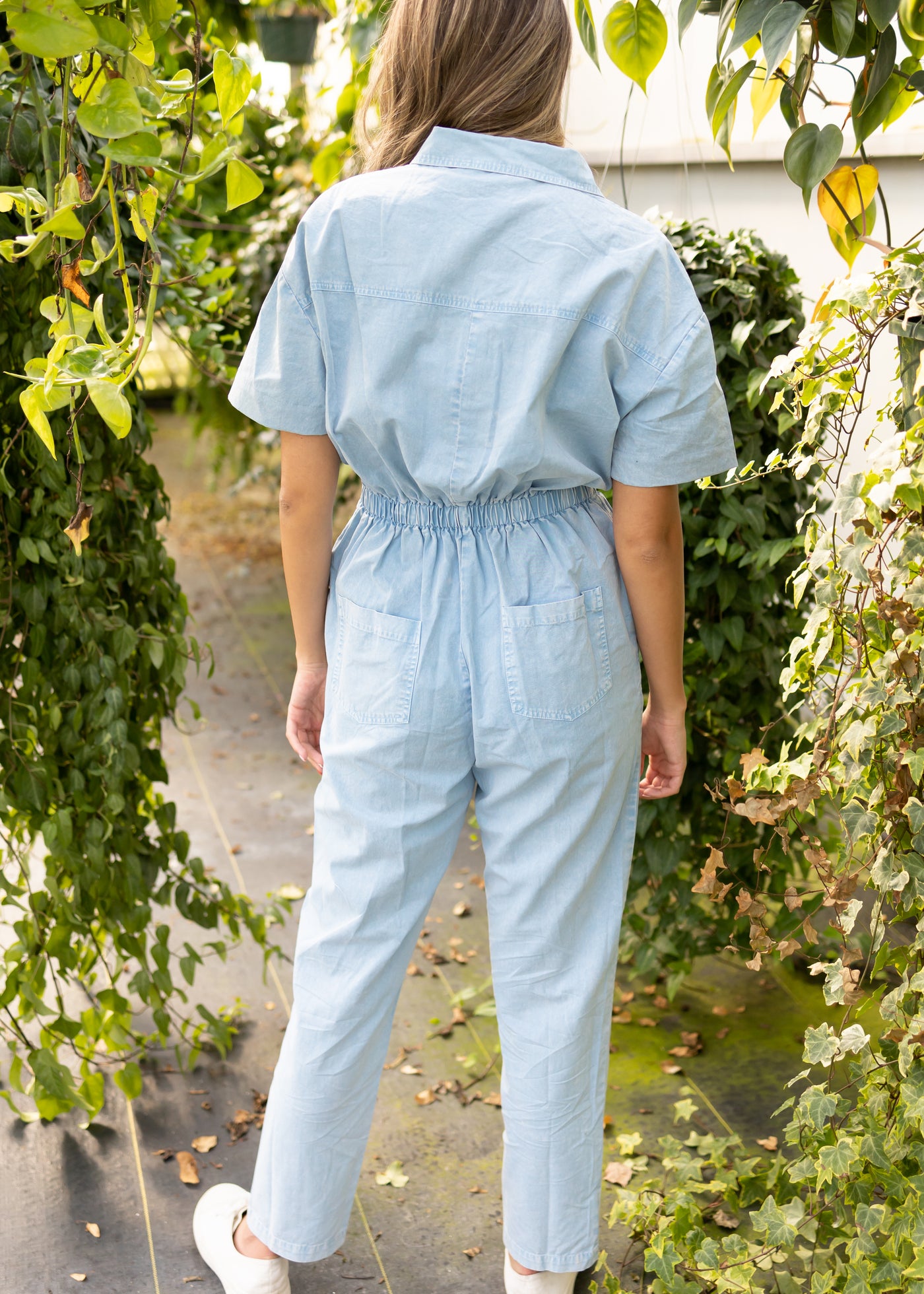 Back view of a sky blue jumpsuit