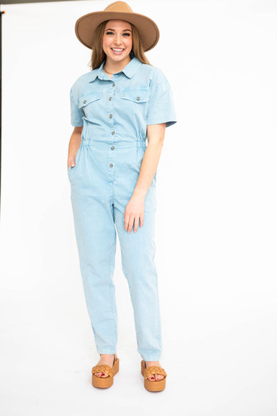 Sky blue jump suit that snaps up the front