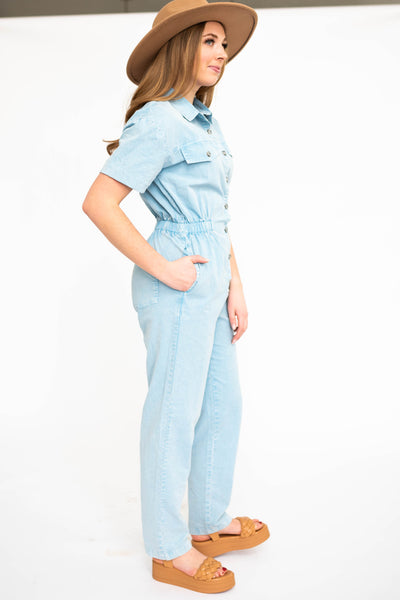 Side view of a sky blue jumpsuit