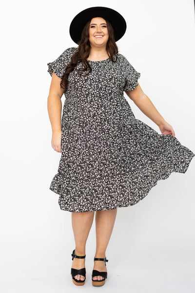 Plus size black floral dress with ruffle at the hem and sleeves