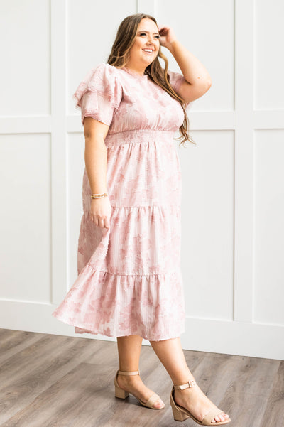 Plus size of a side view of a rose floral dress