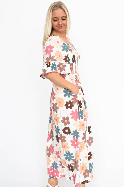 Side view of a cream floral dress