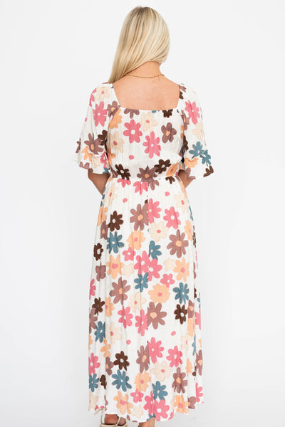 Back view of a cream floral dress